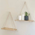 Hanging shelf made of natural wood with hemp rope