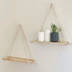 Hanging shelf made of natural wood with hemp rope