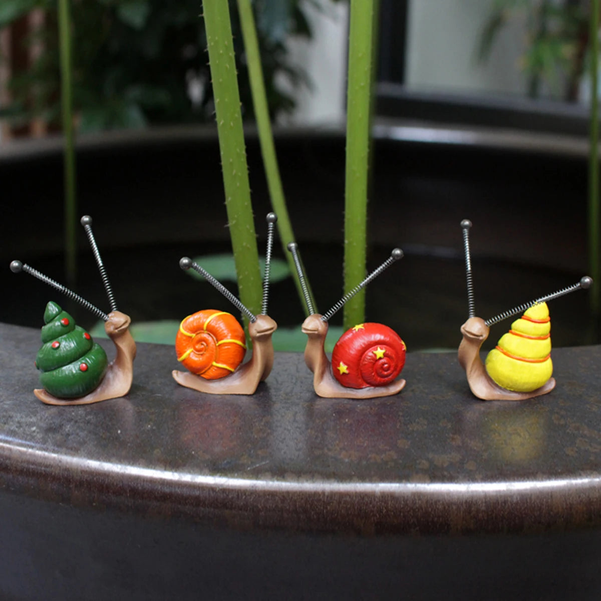 4-teiliges Set niedlicher Schnecken-Miniaturen