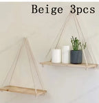 Hanging shelf made of natural wood with hemp rope